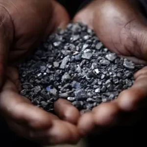 SOUTH KIVU PROVINCE, CONGO - APRIL 28:  A Miner holds tantalum stones April 28, 2010 in Numbi in South Kivu Province, Democratic Republic of Congo. The long war, which had involved 9 African nations and claimed an estimated three million lives as a result of fighting or disease and malnutrition, was fuelled by the regions vast mineral wealth.  (Photo by Kuni Takahashi/Getty Images)